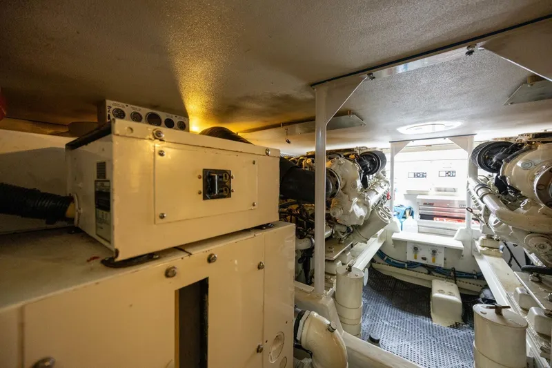 Miss Scarlett Yacht Photos Pics Engine room of a 1998 Viking 50 Convertible yacht, showcasing machinery and equipment.