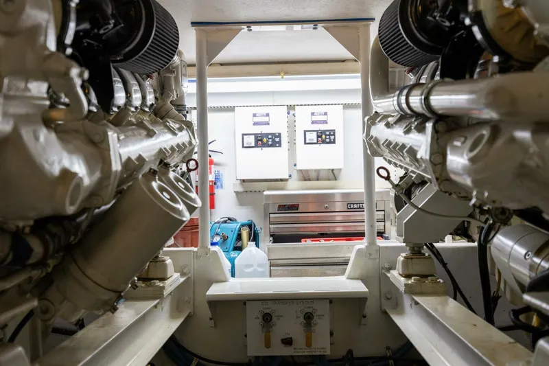 Miss Scarlett Yacht Photos Pics Engine room of a 1998 Viking 50 Convertible yacht, showcasing machinery and control panels.
