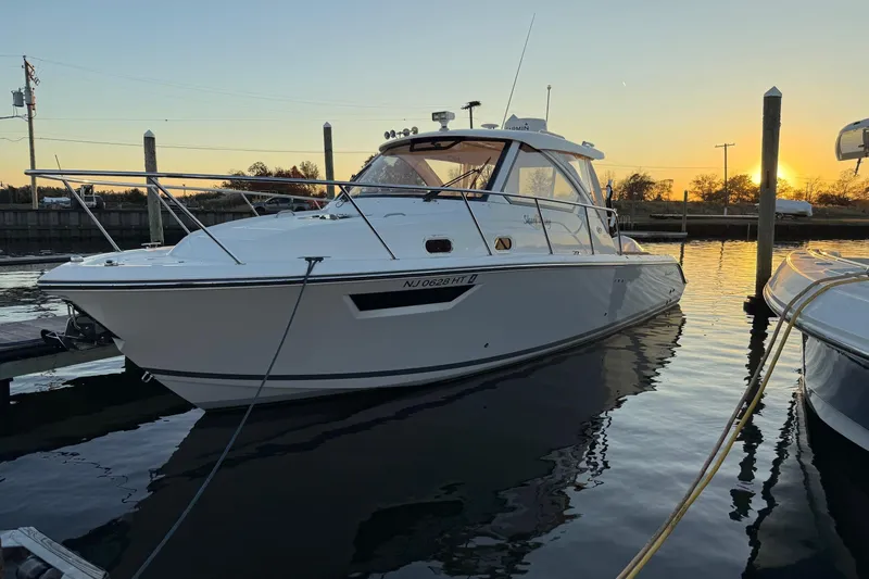  Yacht Photos Pics 2017 Pursuit OS 325 Offshore boat docked at sunset.