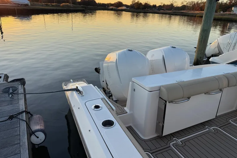  Yacht Photos Pics 2017 Pursuit OS 325 Offshore boat docked at sunset with twin Yamaha engines.