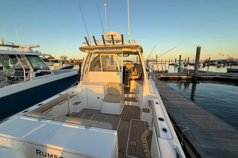  Yacht Photos Pics 2017 Pursuit OS 325 Offshore boat docked at marina during sunset.