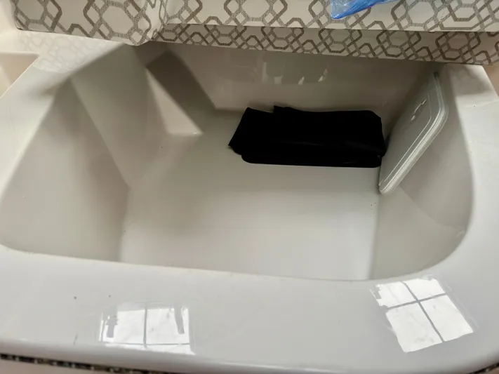  Yacht Photos Pics 2022 Cutwater C32 Northwest Edition interior sink with patterned cover.