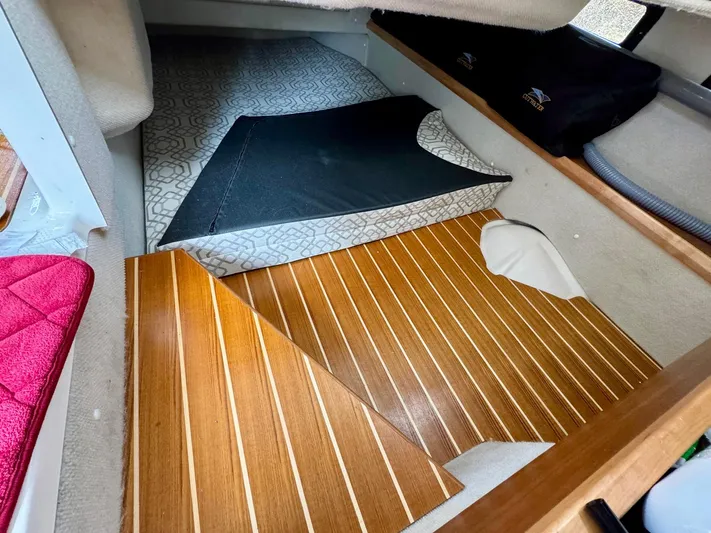  Yacht Photos Pics 2022 Cutwater C32 Northwest Edition interior with wood flooring and patterned carpet.