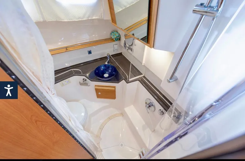  Yacht Photos Pics 2022 Cutwater C32 Northwest Edition bathroom with modern fixtures and compact design.
