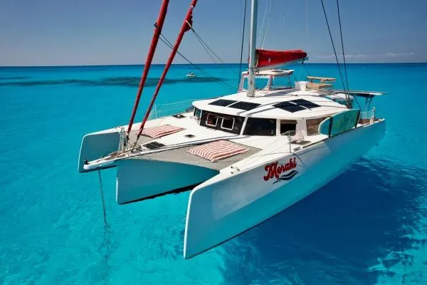 Meraki Yacht Photos Pics 2022 NEEL 43 catamaran sailing on clear turquoise waters.