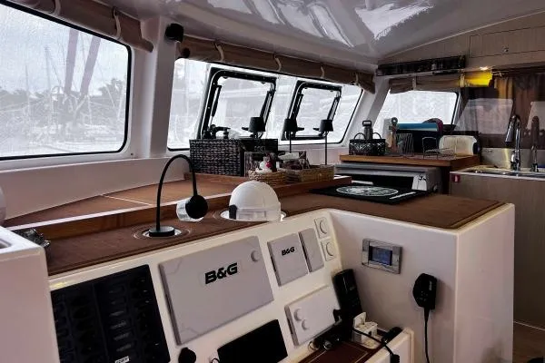 Meraki Yacht Photos Pics Interior of 2022 NEEL 43 trimaran with modern navigation equipment and kitchen area.