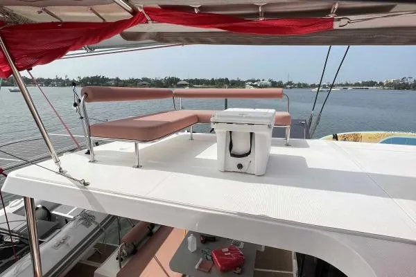 Meraki Yacht Photos Pics 2022 NEEL 43 catamaran deck with seating and ocean view.