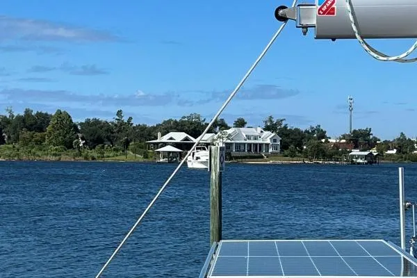 Meraki Yacht Photos Pics Sailing on a NEEL 43 trimaran, 2022 model, with scenic waterfront view.