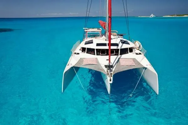 Meraki Yacht Photos Pics 2022 NEEL 43 trimaran sailing on clear turquoise waters.