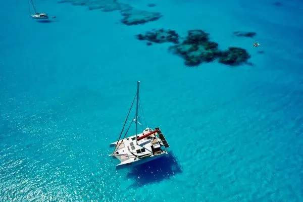 Meraki Yacht Photos Pics Trimaran NEEL 43 sailing in clear turquoise waters, 2022 model.