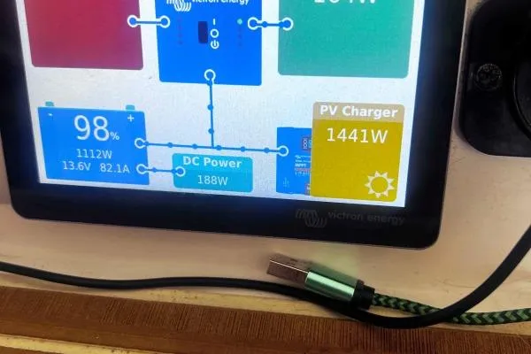 Meraki Yacht Photos Pics Touchscreen display showing power management data for NEEL 43, 2022 model, with PV charger details.