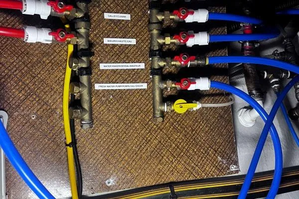 Meraki Yacht Photos Pics Plumbing system with labeled pipes and valves in a 2022 NEEL 43 model.