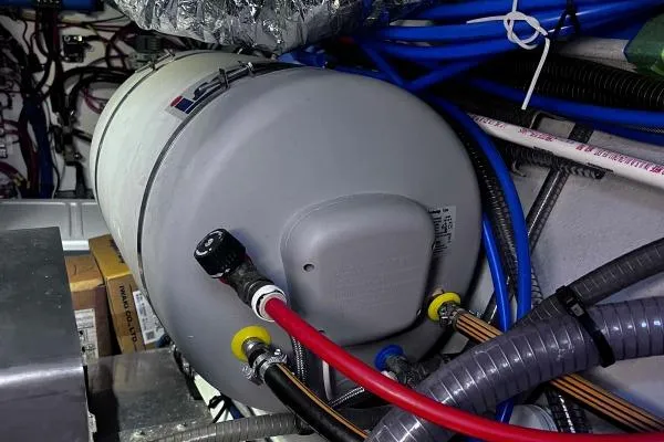 Meraki Yacht Photos Pics Engine room of a 2022 NEEL 43 with various cables and a cylindrical component.