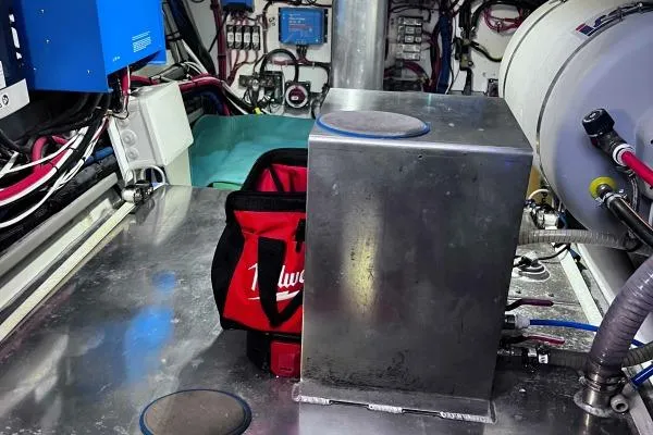 Meraki Yacht Photos Pics Engine room of 2022 NEEL 43 with tools and equipment, featuring a red Milwaukee bag.