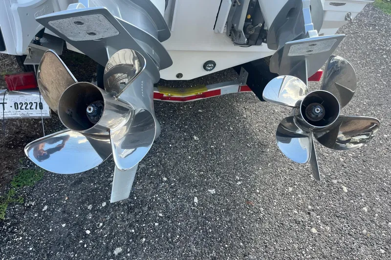  Yacht Photos Pics 2025 Blackfin 252 CC boat propellers on trailer, showcasing dual stainless steel blades.