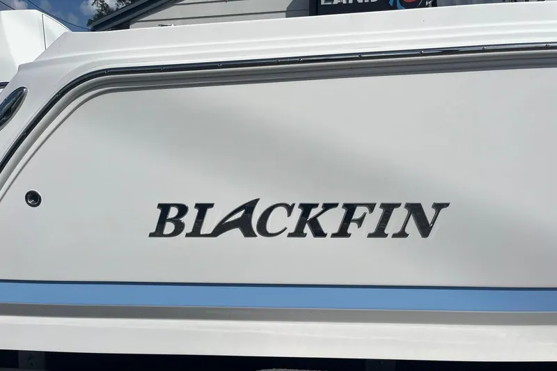  Yacht Photos Pics 2025 Blackfin 252 CC boat with logo on white hull.