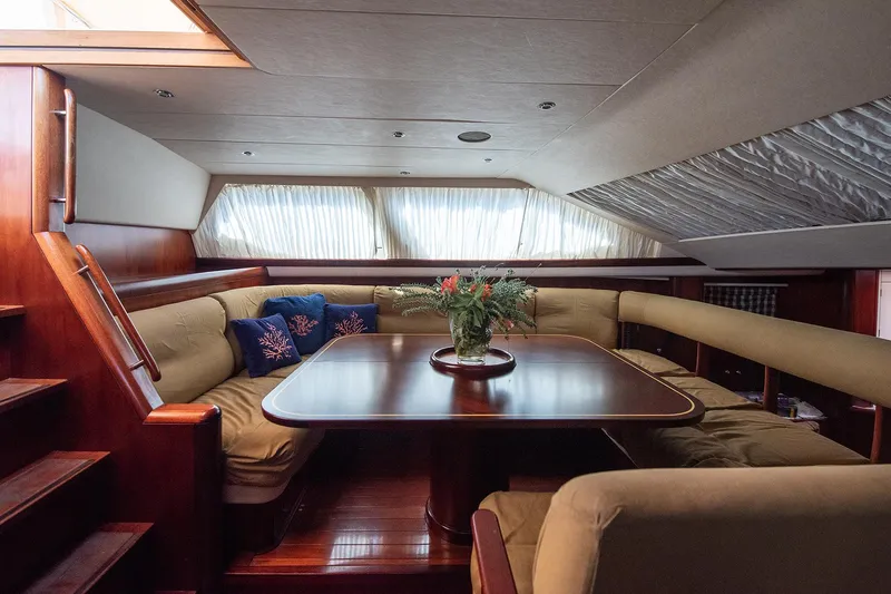 Cygnus Of Anglesey Yacht Photos Pics Luxurious interior of 2004 Oyster 82 yacht with elegant seating and dining area.