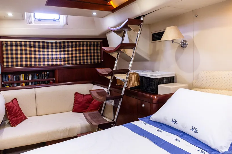 Cygnus Of Anglesey Yacht Photos Pics Luxurious 2004 Oyster 82 yacht interior with cozy seating and elegant decor.