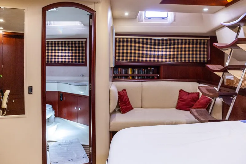 Cygnus Of Anglesey Yacht Photos Pics Luxurious interior of 2004 Oyster 82 yacht with cozy seating and elegant wood finishes.