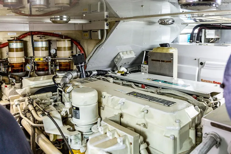 Cygnus Of Anglesey Yacht Photos Pics Engine room of a 2004 Oyster 82 yacht, featuring Cummins Onan generator.