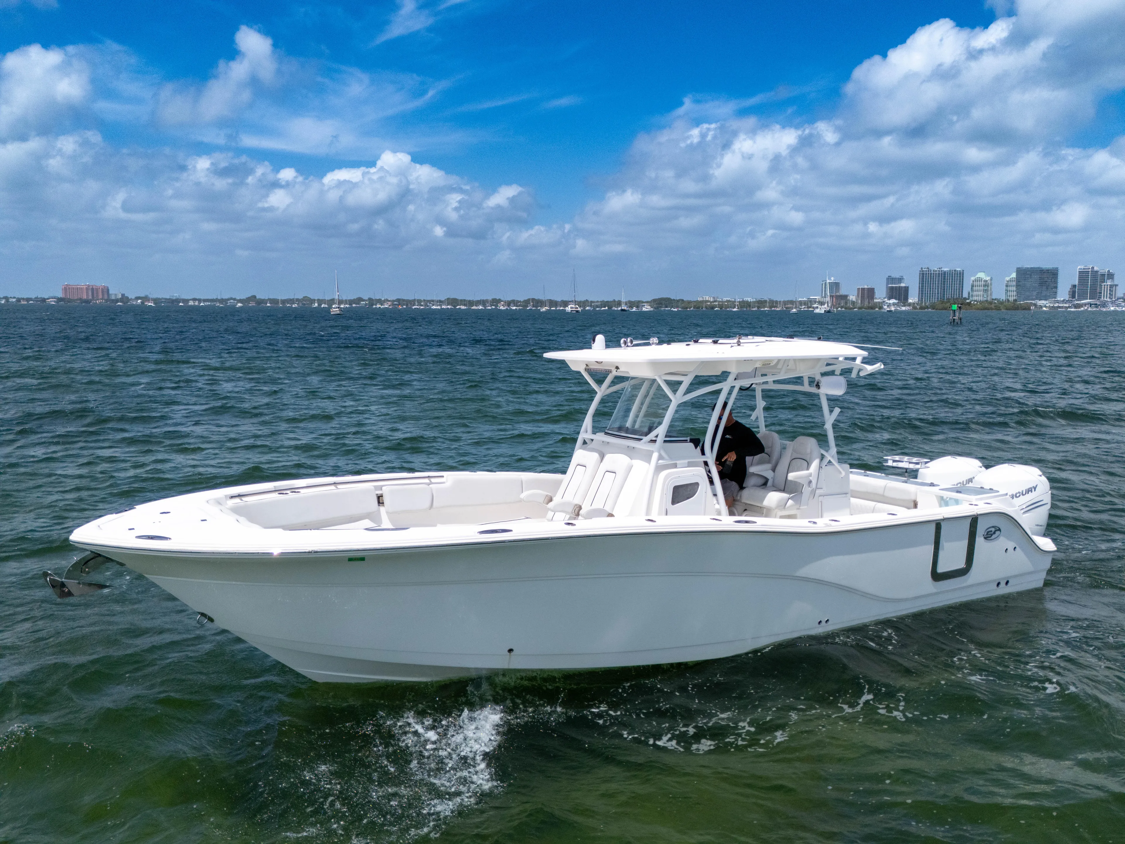  Yacht Photos Pics 2021 Sea Fox 328 Commander boat cruising on open water under a clear blue sky.