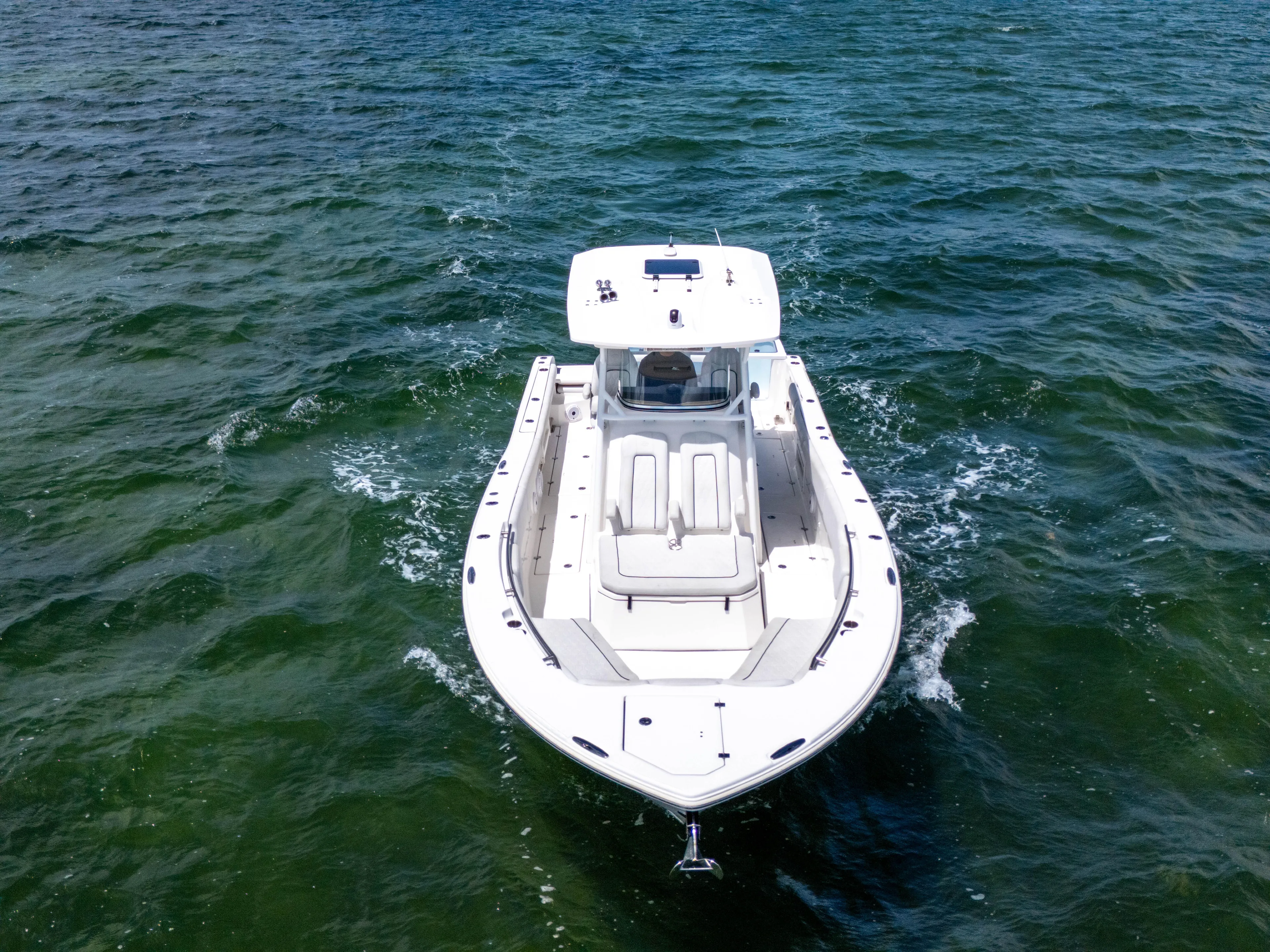  Yacht Photos Pics 2021 Sea Fox 328 Commander boat cruising on open water.