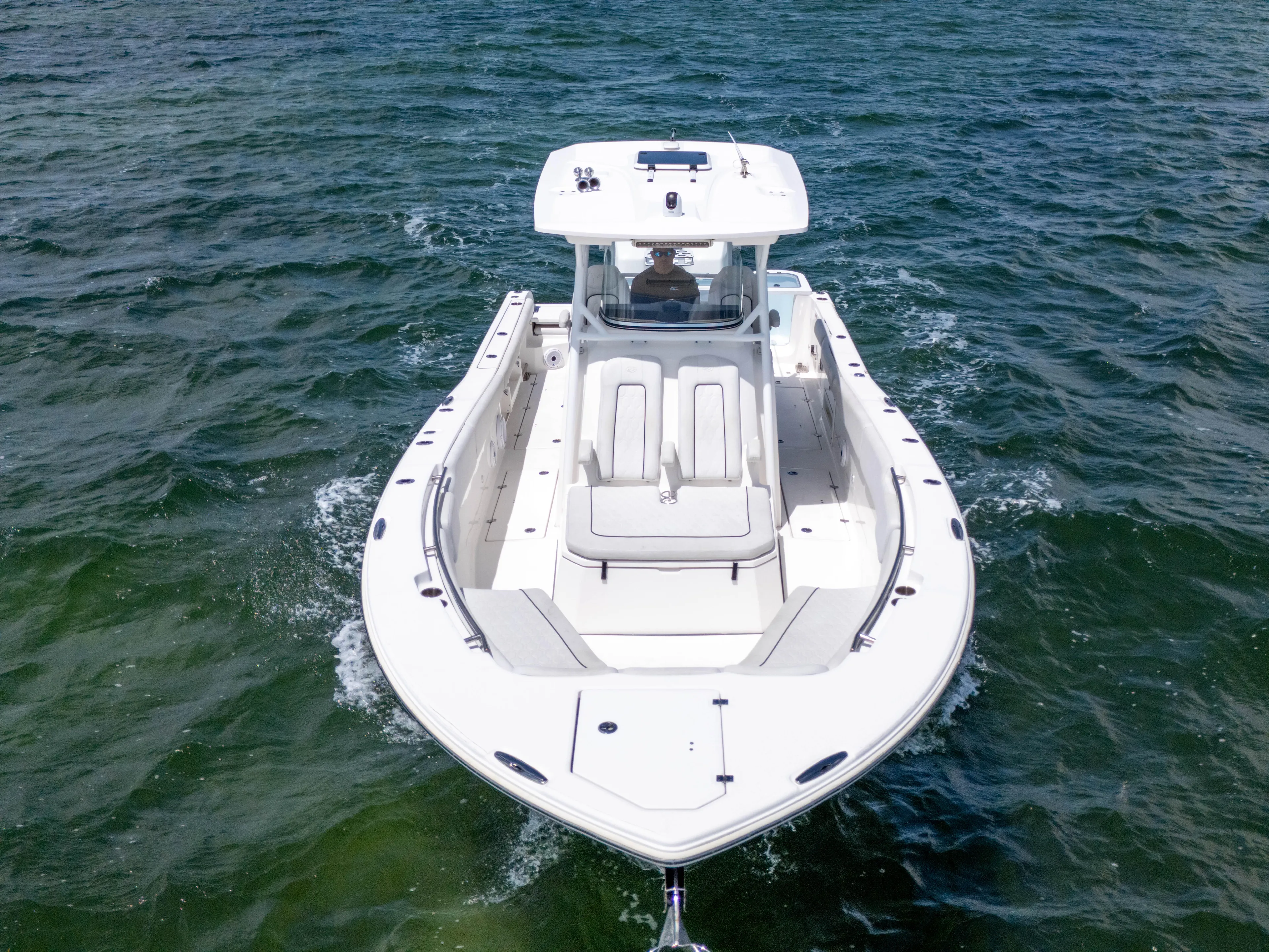  Yacht Photos Pics 2021 Sea Fox 328 Commander boat cruising on open water, aerial view.