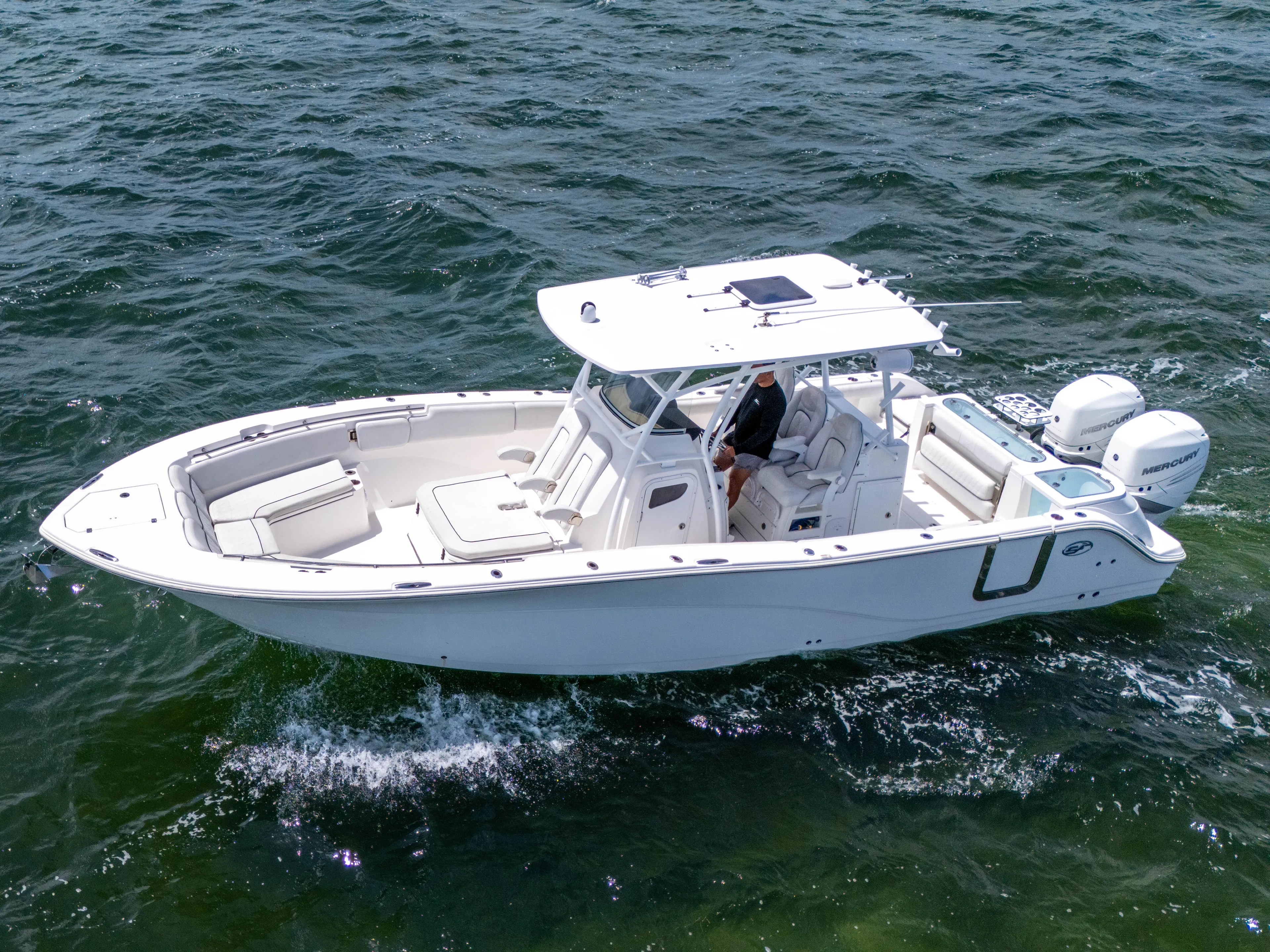  Yacht Photos Pics 2021 Sea Fox 328 Commander boat cruising on open water.