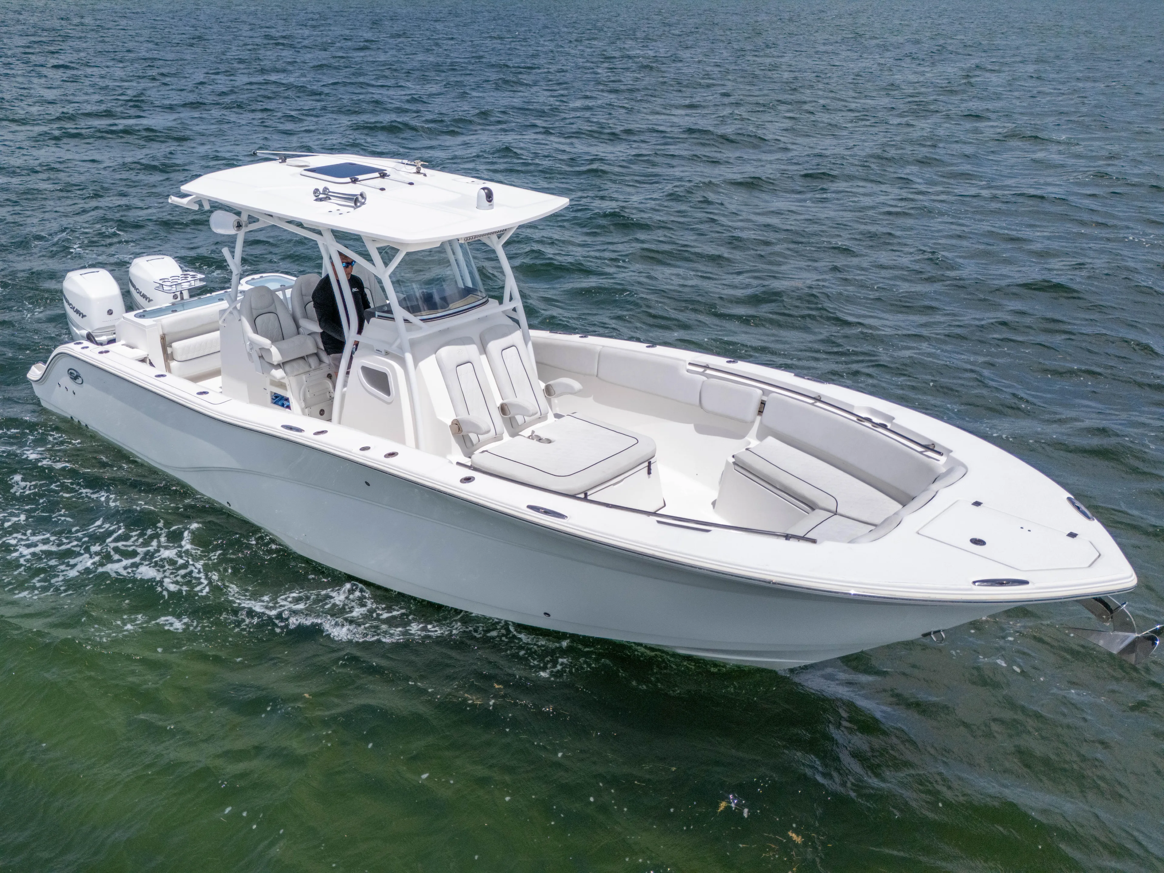  Yacht Photos Pics 2021 Sea Fox 328 Commander boat cruising on open water, showcasing sleek design and twin engines.