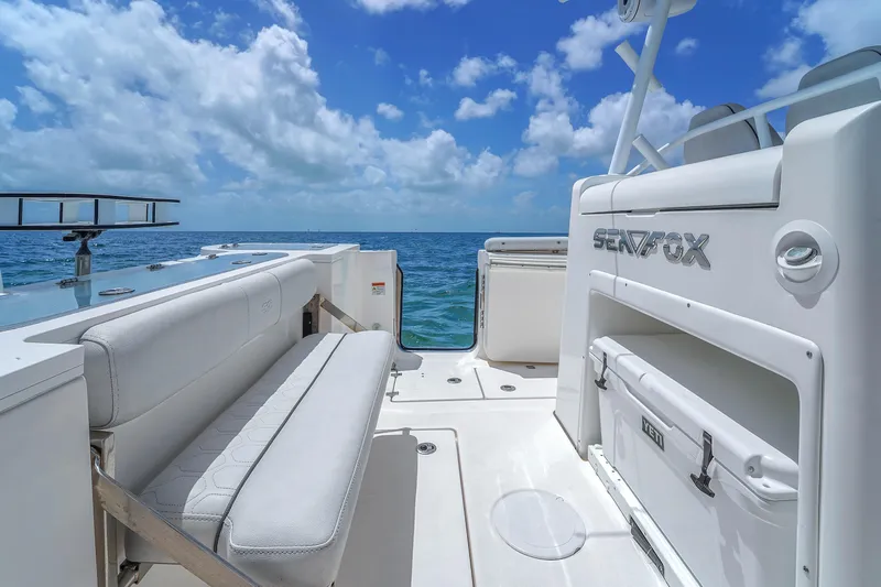  Yacht Photos Pics 2021 Sea Fox 328 Commander boat interior with ocean view, featuring seating and storage.
