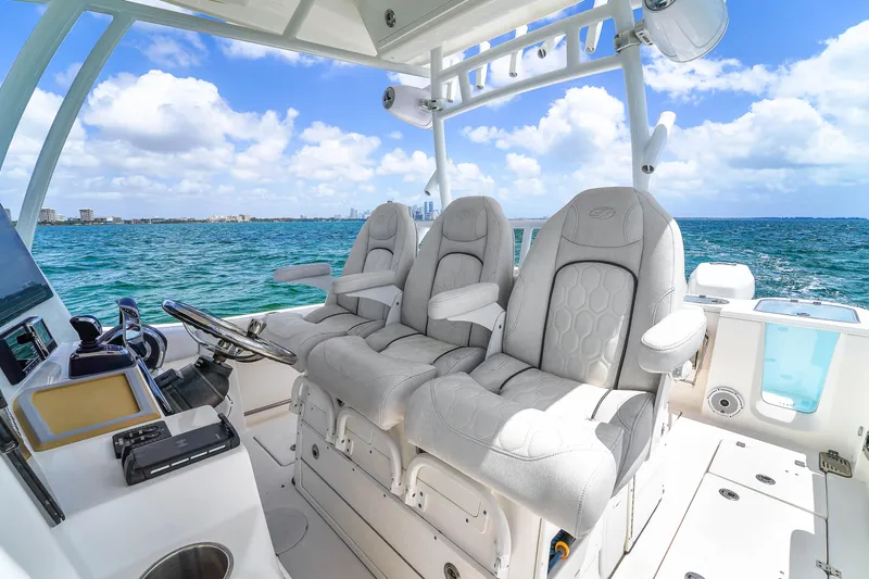 Yacht Photos Pics 2021 Sea Fox 328 Commander boat interior with luxurious seating, ocean view, and clear skies.