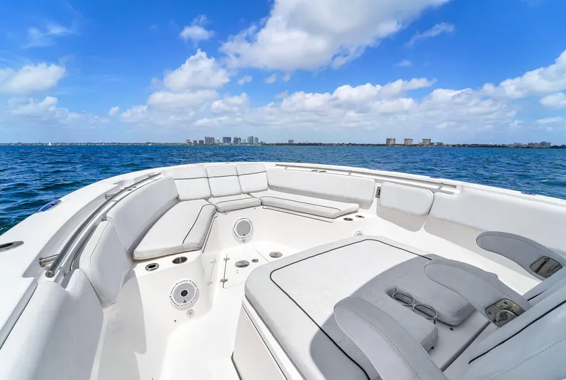  Yacht Photos Pics 2021 Sea Fox 328 Commander boat with spacious seating, cruising on open water under a clear blue sky.