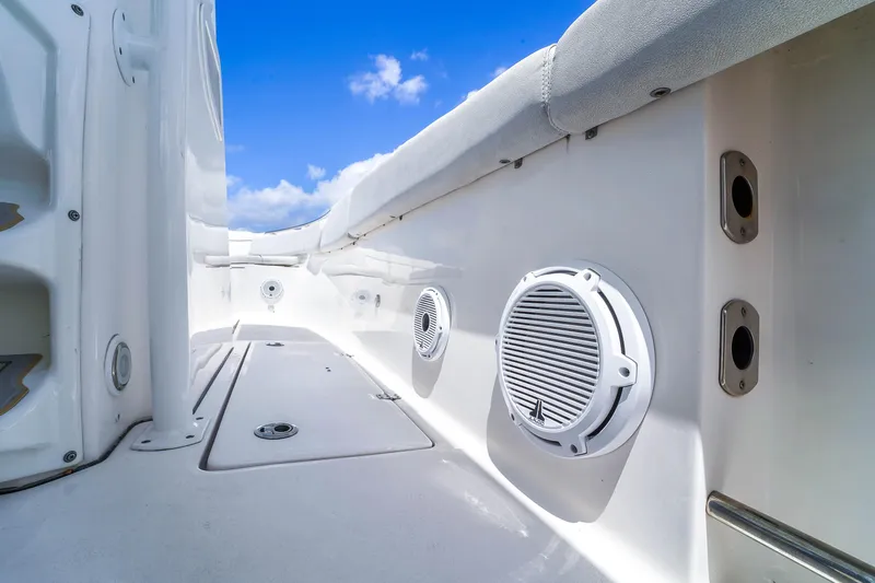  Yacht Photos Pics 2021 Sea Fox 328 Commander boat interior with speakers, under a clear blue sky.