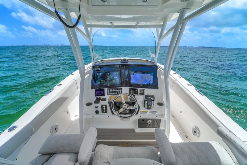  Yacht Photos Pics 2021 Sea Fox 328 Commander boat cockpit with advanced navigation system on open sea.