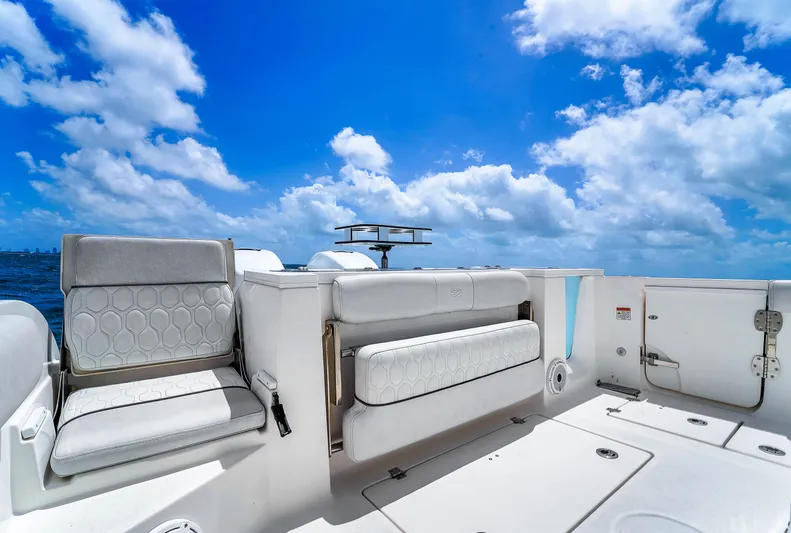  Yacht Photos Pics 2021 Sea Fox 328 Commander boat interior with seating, under a bright blue sky.