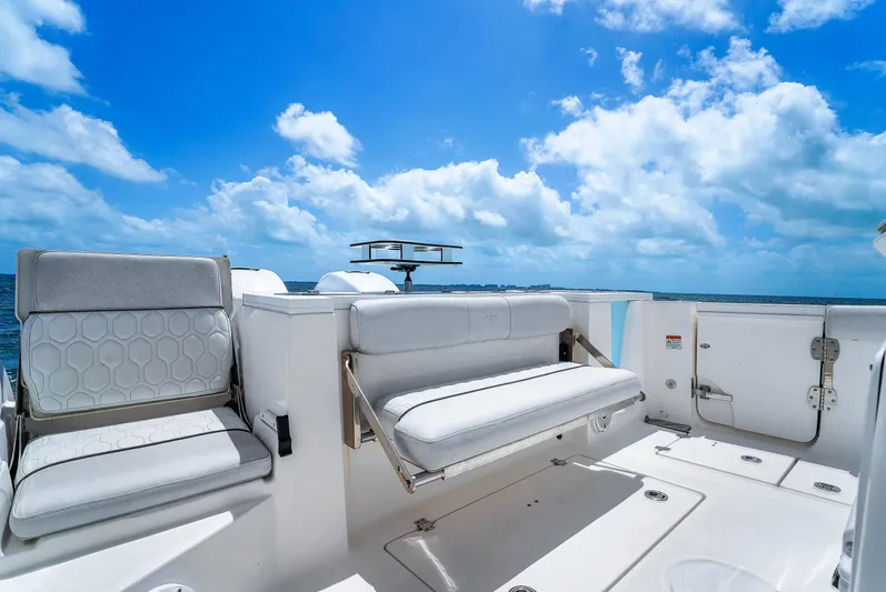  Yacht Photos Pics 2021 Sea Fox 328 Commander boat interior with seating, under a bright blue sky.