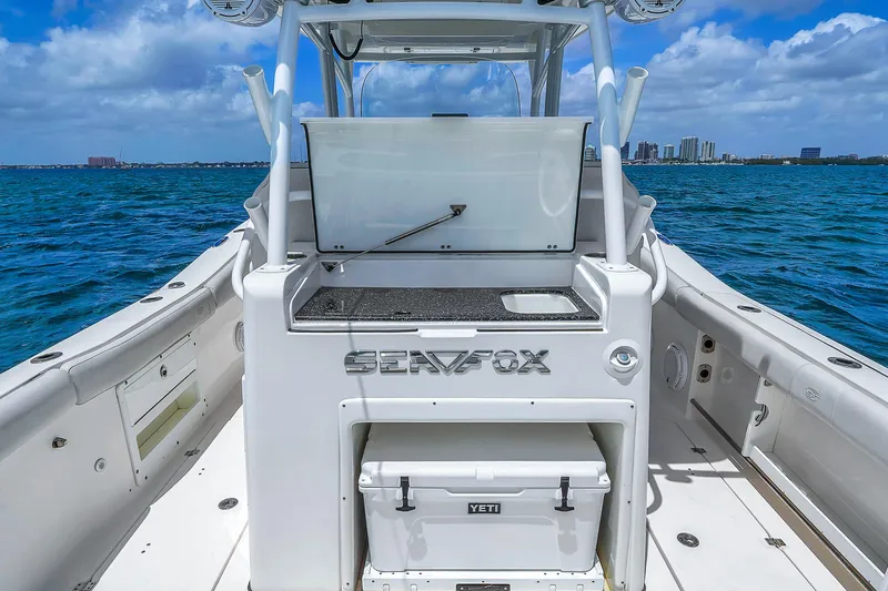 Yacht Photos Pics 2021 Sea Fox 328 Commander boat with open deck and Yeti cooler on ocean.