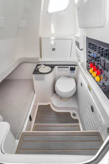  Yacht Photos Pics 2021 Sea Fox 328 Commander boat interior with toilet and control panel.