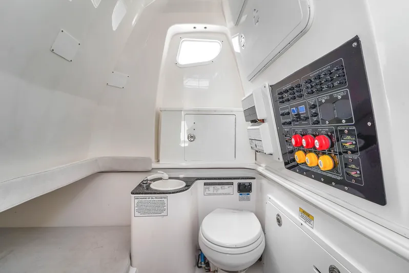  Yacht Photos Pics 2021 Sea Fox 328 Commander interior with control panel and marine toilet.