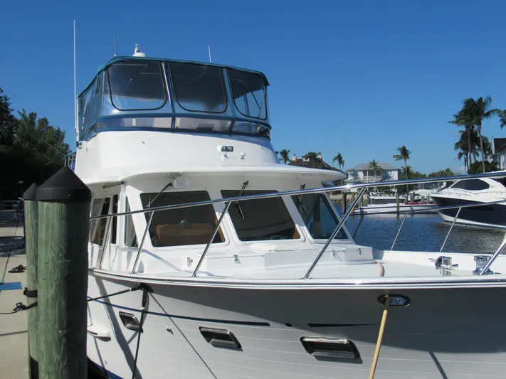 C'est La Vie Yacht Photos Pics 2010 DeFever 48 Offshore yacht docked at a marina on a sunny day.