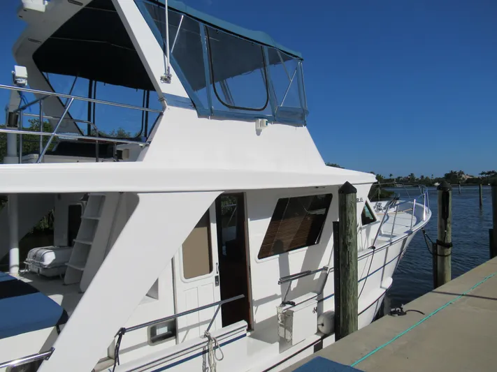 C'est La Vie Yacht Photos Pics 2010 DeFever 48 Offshore yacht docked at a marina on a sunny day.