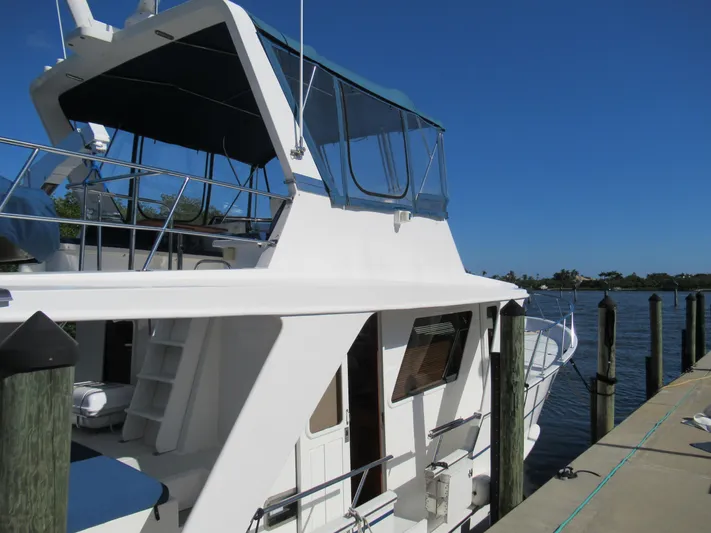 C'est La Vie Yacht Photos Pics 2010 DeFever 48 Offshore yacht docked at a marina on a sunny day.