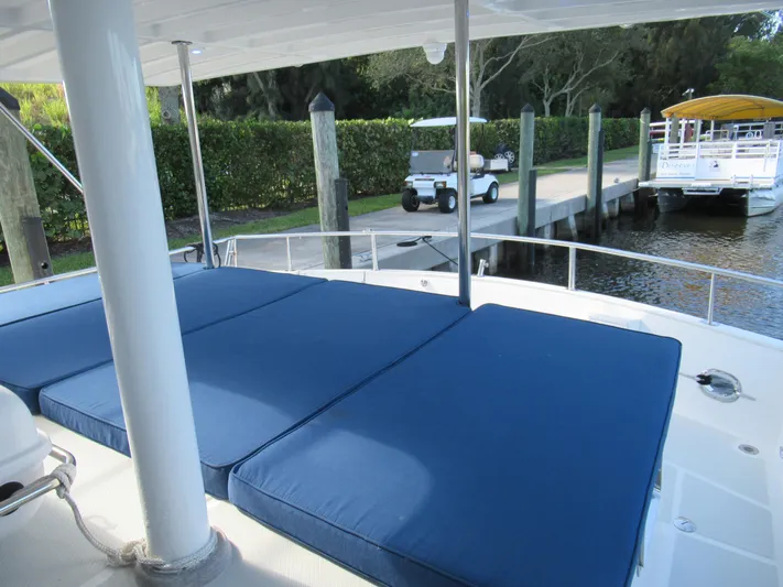 C'est La Vie Yacht Photos Pics 2010 DeFever 48 Offshore yacht with blue deck cushions docked at marina.
