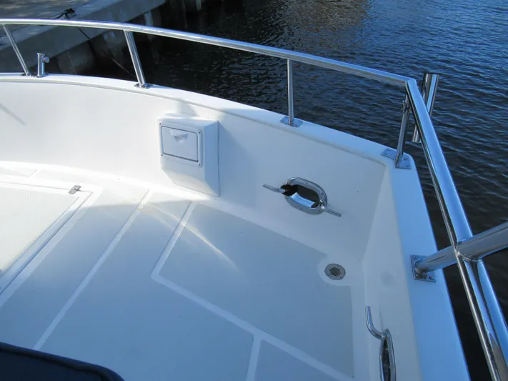 C'est La Vie Yacht Photos Pics DeFever 48 Offshore 2010 boat deck with railing and water view.