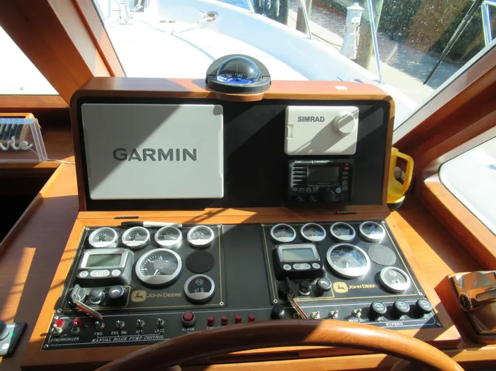 C'est La Vie Yacht Photos Pics Helm station of 2010 DeFever 48 Offshore with Garmin and Simrad navigation systems.