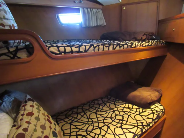 C'est La Vie Yacht Photos Pics Bunk beds in the cabin of a 2010 DeFever 48 Offshore yacht.