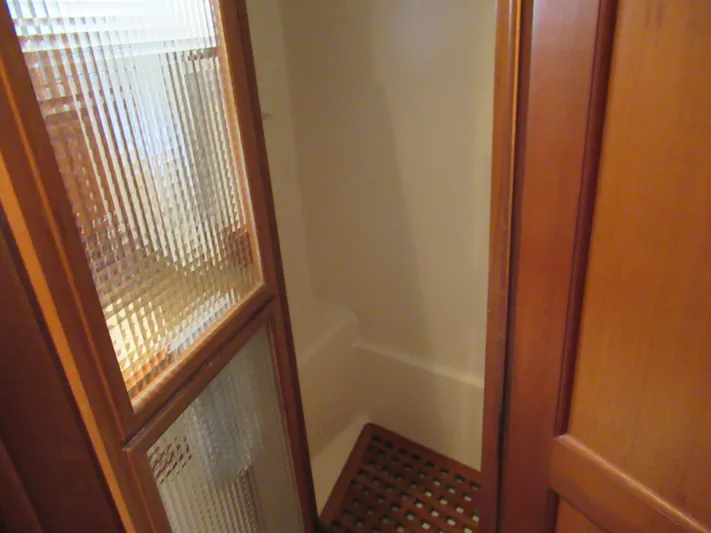 C'est La Vie Yacht Photos Pics 2010 DeFever 48 Offshore yacht shower with wooden grate flooring and frosted glass door.