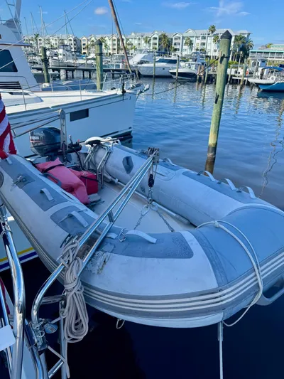 Tranquility Base Yacht Photos Pics Inflatable dinghy docked at marina, near PDQ-34 boat, 2003 model.