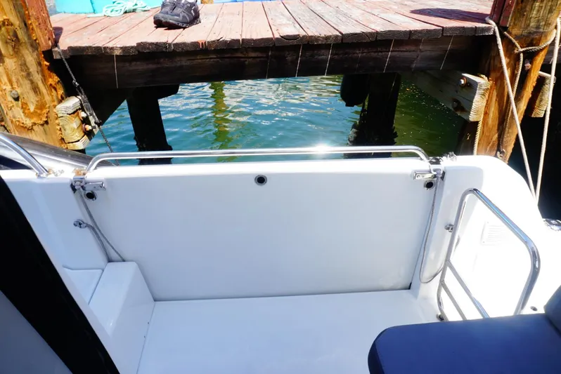 Boondoggle Yacht Photos Pics Beneteau Antares 11, 2022 model, docked with open deck view.