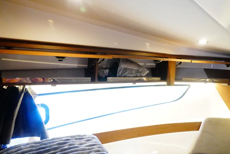 Boondoggle Yacht Photos Pics Interior cabin of 2022 Beneteau Antares 11, featuring modern design and cozy lighting.